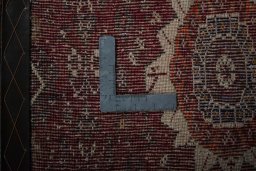 Corner detail of 2000s Shiraz rug showing border pattern and Wool pile
