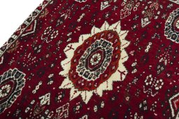 Backside of handmade 2000s Shiraz rug showing knot structure and weave density