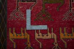 Backside of handmade 2000s Shiraz rug showing knot structure and weave density