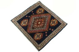 Corner detail of 2000s Shiraz rug showing border pattern and Wool pile