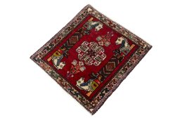 Corner detail of 2000s Shiraz rug showing border pattern and Wool pile
