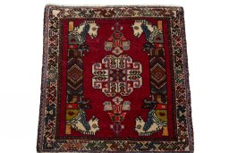 Surface texture of 2000s Shiraz rug with natural Wool and intricate pattern