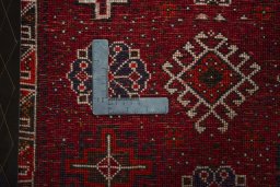 Backside of handmade 2000s Shiraz rug showing knot structure and weave density