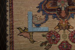 Backside of handmade 2000s Shiraz rug showing knot structure and weave density