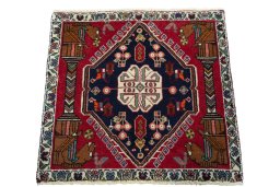 Surface texture of 2000s Shiraz rug with natural Wool and intricate pattern