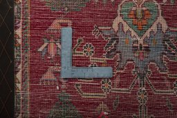 Backside of handmade 2000s Shiraz rug showing knot structure and weave density