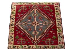 Surface texture of 2000s Shiraz rug with natural Wool and intricate pattern