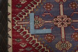 Backside of handmade 2000s Shiraz rug showing knot structure and weave density