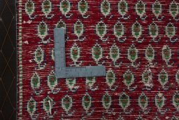 Backside of handmade 2000s Shiraz rug showing knot structure and weave density