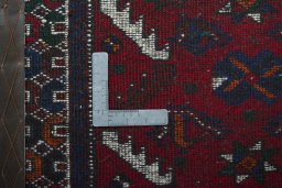 Backside of handmade 2000s Shiraz rug showing knot structure and weave density
