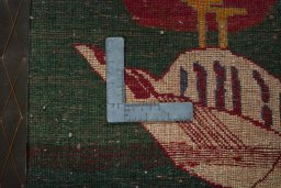 Backside of handmade 2000s Shiraz rug showing knot structure and weave density