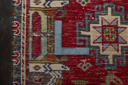 Backside of handmade 2000s Shiraz rug showing knot structure and weave density