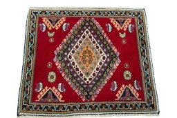 Surface texture of 2000s Shiraz rug with natural Wool and intricate pattern