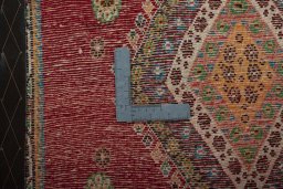 Backside of handmade 2000s Shiraz rug showing knot structure and weave density