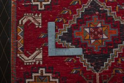 Backside of handmade 2000s Shiraz rug showing knot structure and weave density