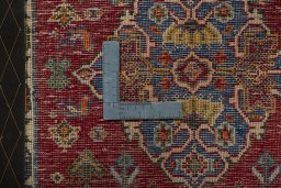 Backside of handmade 2000s Shiraz rug showing knot structure and weave density