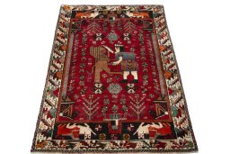 Surface texture of 2000s Shiraz rug with natural Wool and intricate pattern