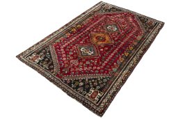 Corner detail of 2000s Shiraz rug showing border pattern and Wool pile