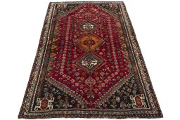 Surface texture of 2000s Shiraz rug with natural Wool and intricate pattern