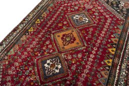 Backside of handmade 2000s Shiraz rug showing knot structure and weave density