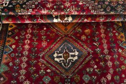 Full view of 2000s Shiraz rug from Iran / Persia, 253 × 164 cm in Red tones