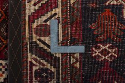 Surface texture of 2000s Shiraz rug with natural Wool and intricate pattern