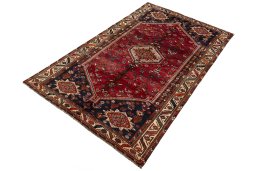 Corner detail of 2000s Shiraz rug showing border pattern and Wool pile