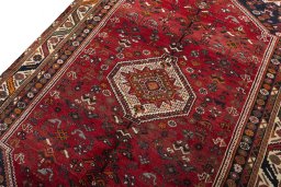 Backside of handmade 2000s Shiraz rug showing knot structure and weave density
