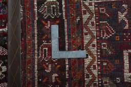 Surface texture of 1970s Shiraz rug with natural Wool and intricate pattern