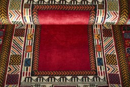 Corner detail of 2000s Shiraz rug showing border pattern and Wool pile