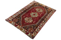 Corner detail of 2000s Shiraz rug showing border pattern and Wool pile