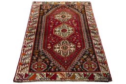 Surface texture of 2000s Shiraz rug with natural Wool and intricate pattern