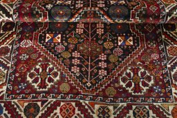Corner detail of 2000s Shiraz rug showing border pattern and Wool pile