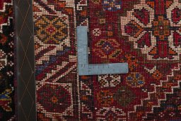 Surface texture of 2000s Shiraz rug with natural Wool and intricate pattern