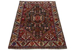 Surface texture of 2000s Shiraz rug with natural Wool and intricate pattern