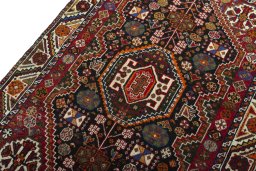 Backside of handmade 2000s Shiraz rug showing knot structure and weave density