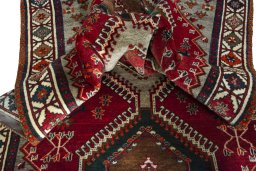 Corner detail of 2000s Shiraz rug showing border pattern and Wool pile