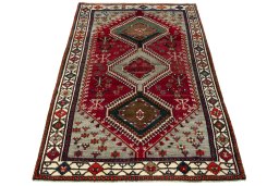 Surface texture of 2000s Shiraz rug with natural Wool and intricate pattern