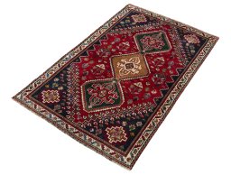 Corner detail of 2000s Shiraz rug showing border pattern and Wool pile