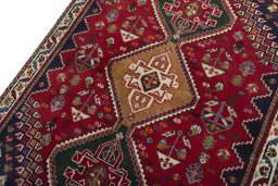 Backside of handmade 2000s Shiraz rug showing knot structure and weave density