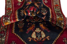 Corner detail of 2000s Shiraz rug showing border pattern and Wool pile