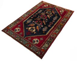Corner detail of 2000s Shiraz rug showing border pattern and Wool pile