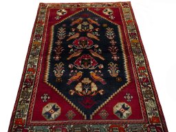 Surface texture of 2000s Shiraz rug with natural Wool and intricate pattern