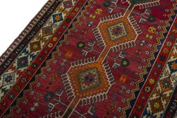 Backside of handmade 2000s Shiraz rug showing knot structure and weave density