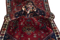 Corner detail of 2000s Shiraz rug showing border pattern and Wool pile