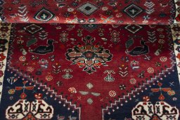 Full view of 2000s Shiraz rug from Iran / Persia, 190 × 110 cm in Red tones