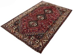 Corner detail of 2000s Shiraz rug showing border pattern and Wool pile