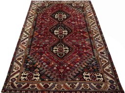 Surface texture of 2000s Shiraz rug with natural Wool and intricate pattern