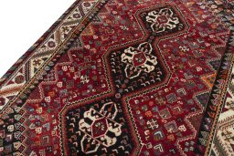 Backside of handmade 2000s Shiraz rug showing knot structure and weave density