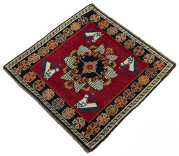 Corner detail of 2000s Shiraz rug showing border pattern and Wool pile